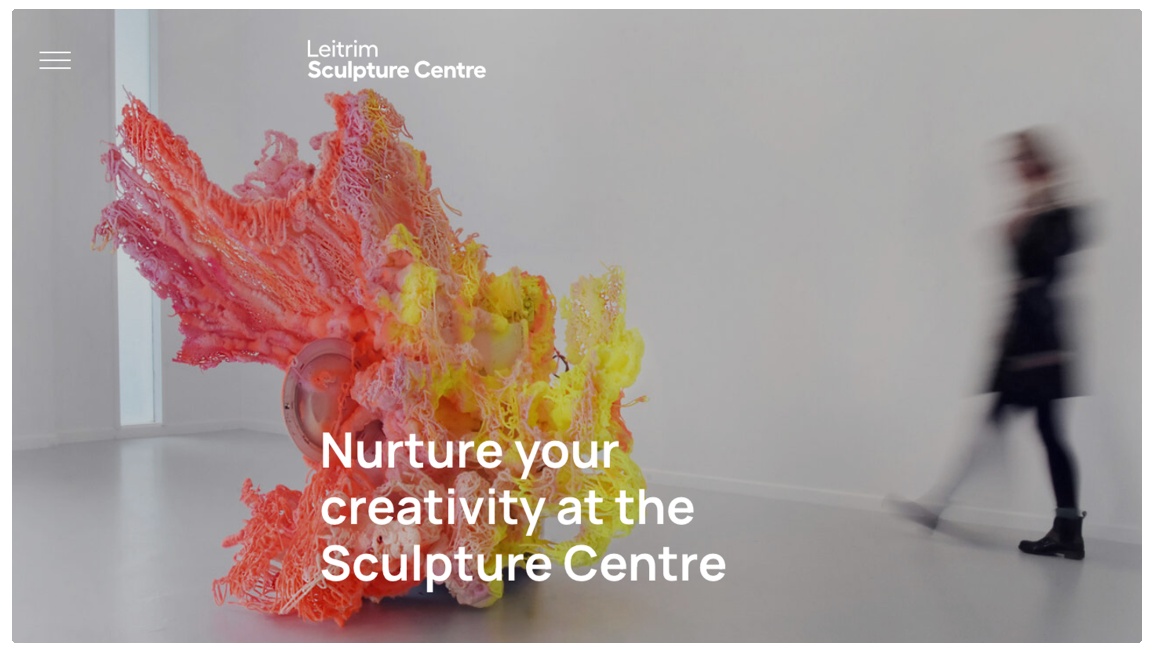 Desktop view of homepage showing full width ad height image of an exhibition. Text overlaid reads 'Nuture your creativity at the Sculpture Centre'