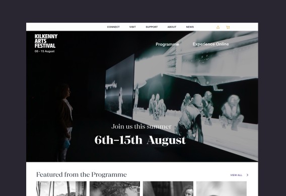 Desktop homepage with full width and height photo and festival dates in the centre.